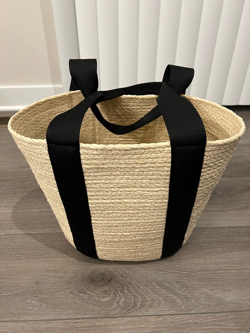Straw Rope Woven Market Basket Tote w/ Black Handles. 12” tall x 15.5” wide.